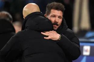Atletico Madrid's Argentinian manager Diego Simeone (right) and Manchester City's Spanish manager Pep Guardiola embrace before kick-off 