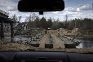 A temporary crossing built by the Ukrainian military to replace a bridge that was destroyed by retreating Russian forces.