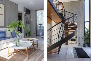 The helicoidal staircase – made of iron painted black and wooden steps, designed by the Studios – is the protagonist of the entrance hall.  Handmade sheep wool rug (Seara).